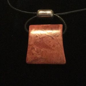 Silpada black leather with dark orange stone